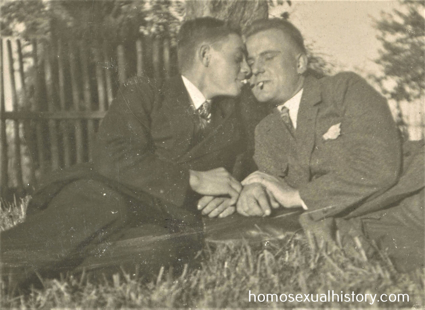 Germany 1920s. Two men relax on ground. Close