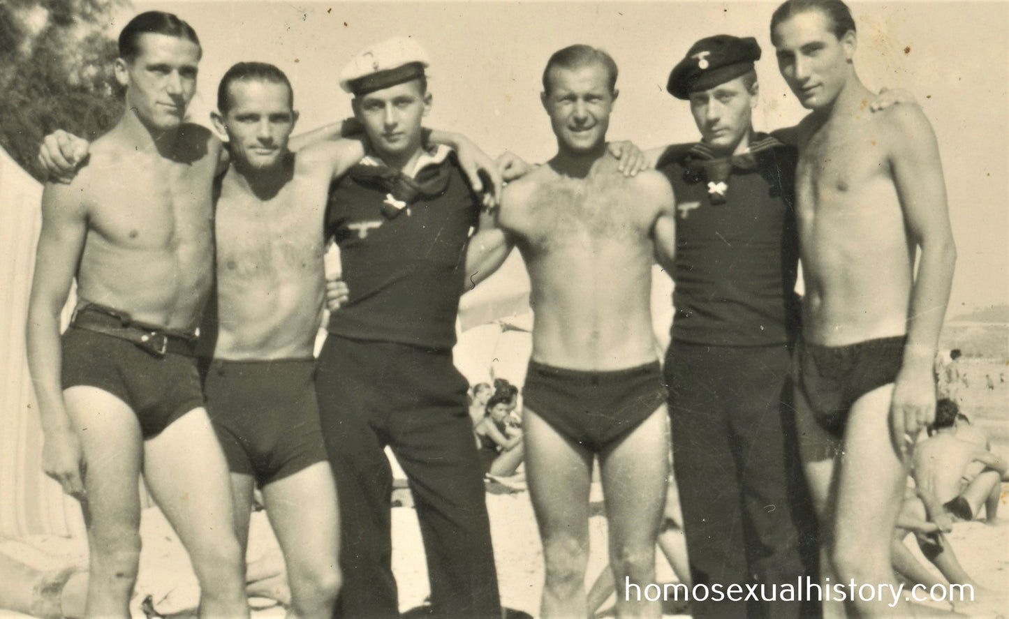 Germany - Military. 1940s WWII. Group of sailors on the beach. Affectionate buddies
