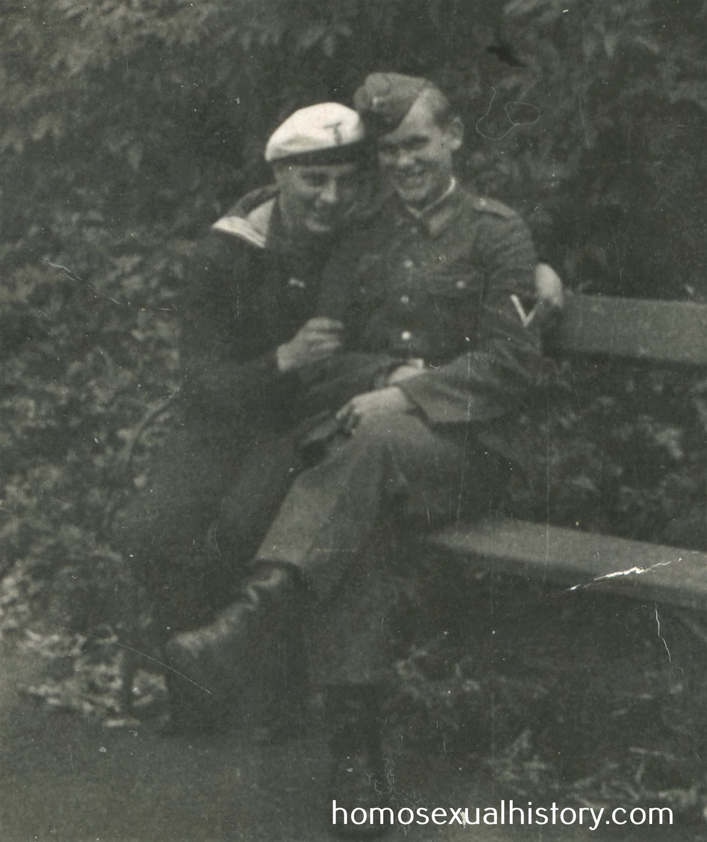 Germany - Military. 1940s WWII. Soldier and sailor cuddle. Gay