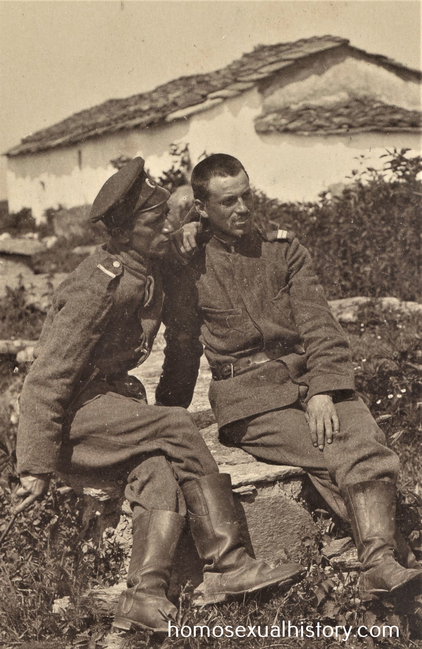 Bulgaria 1917. Two affectionate soldiers sitting outside