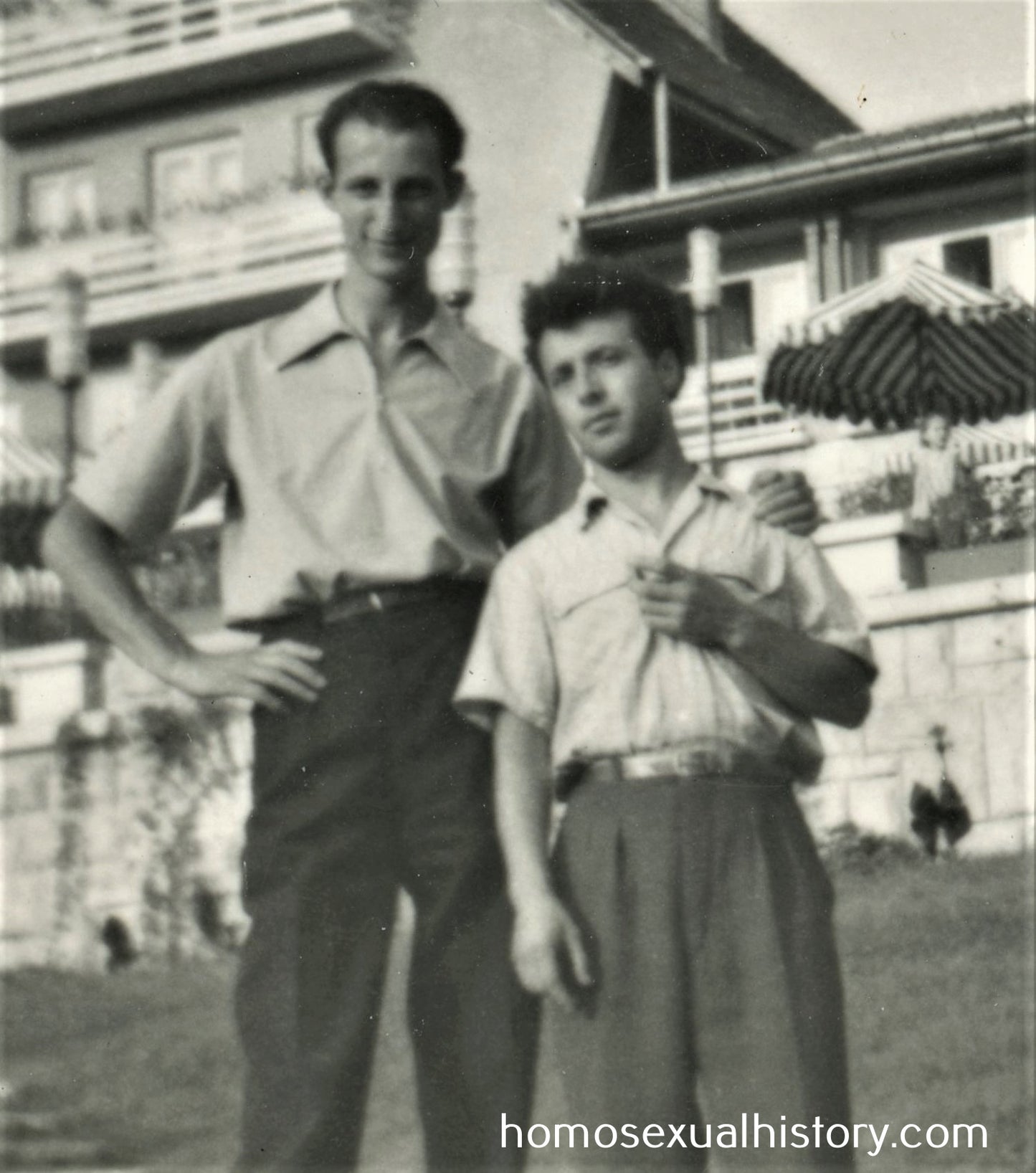 Bulgaria 1950s. Two men outside a hotel. Arm on shoulder