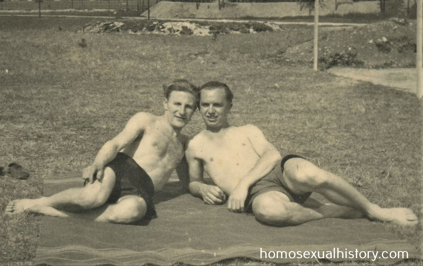 Germany 1930s. Two men. Close. On ground side by side