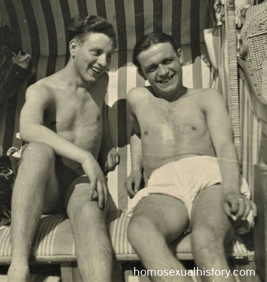 Germany Military. 1940s WWII Two soldiers on sunbeds Close. Beach. Bathers.