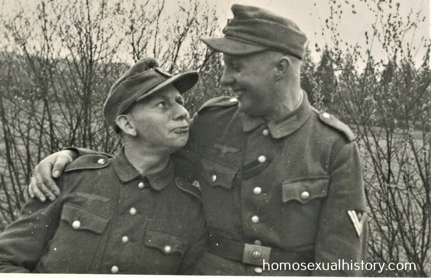 Germany - Military. 1940s WWII. Two affectionate friends stare at each other. Playful. Gay